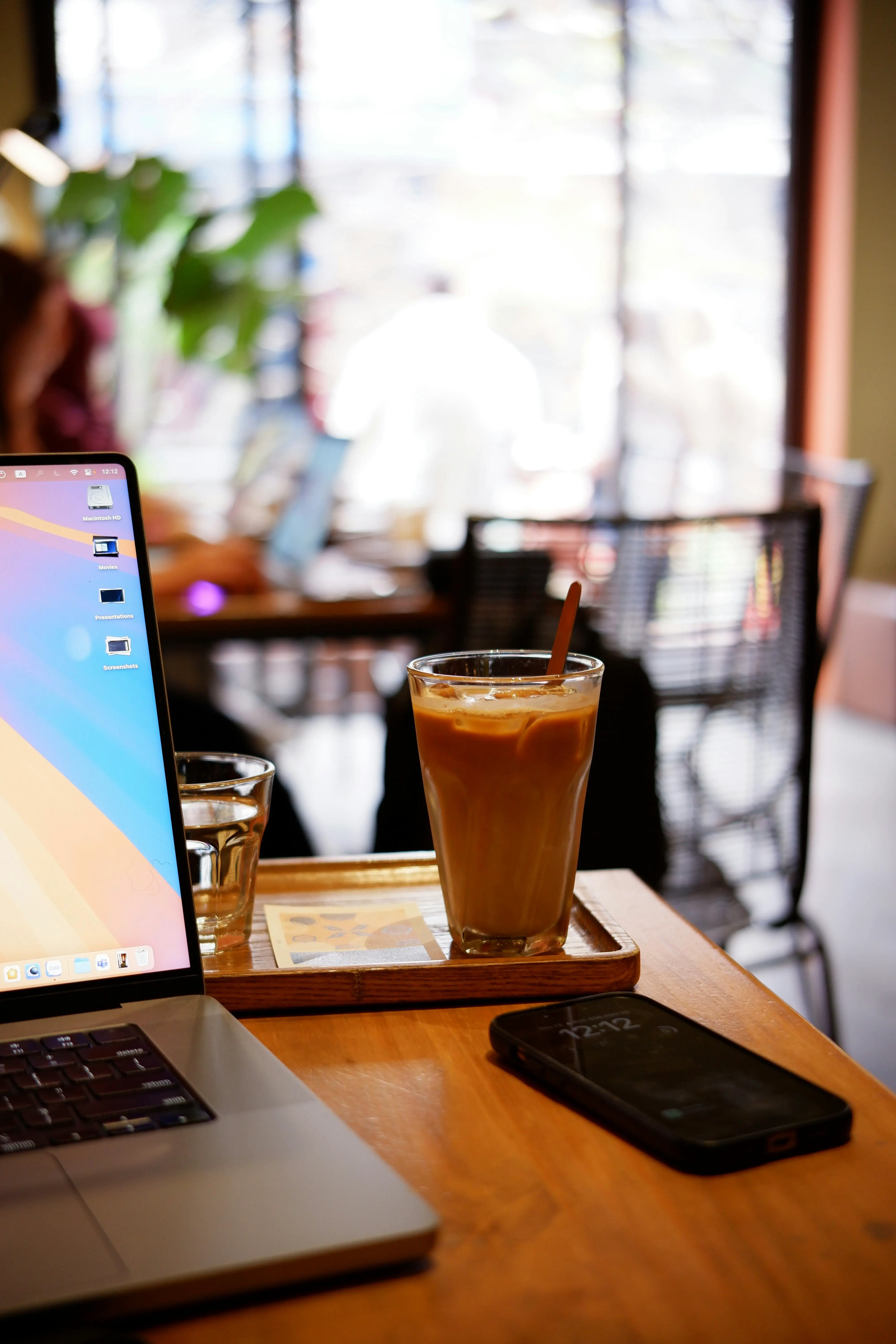 Laptop showing VPN connection in a Thai cafe